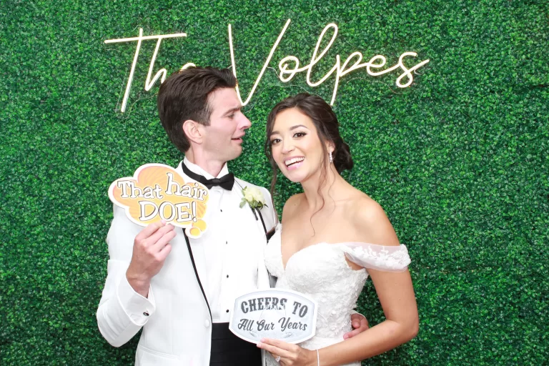 Groom Looking at Bride in Photo Booth